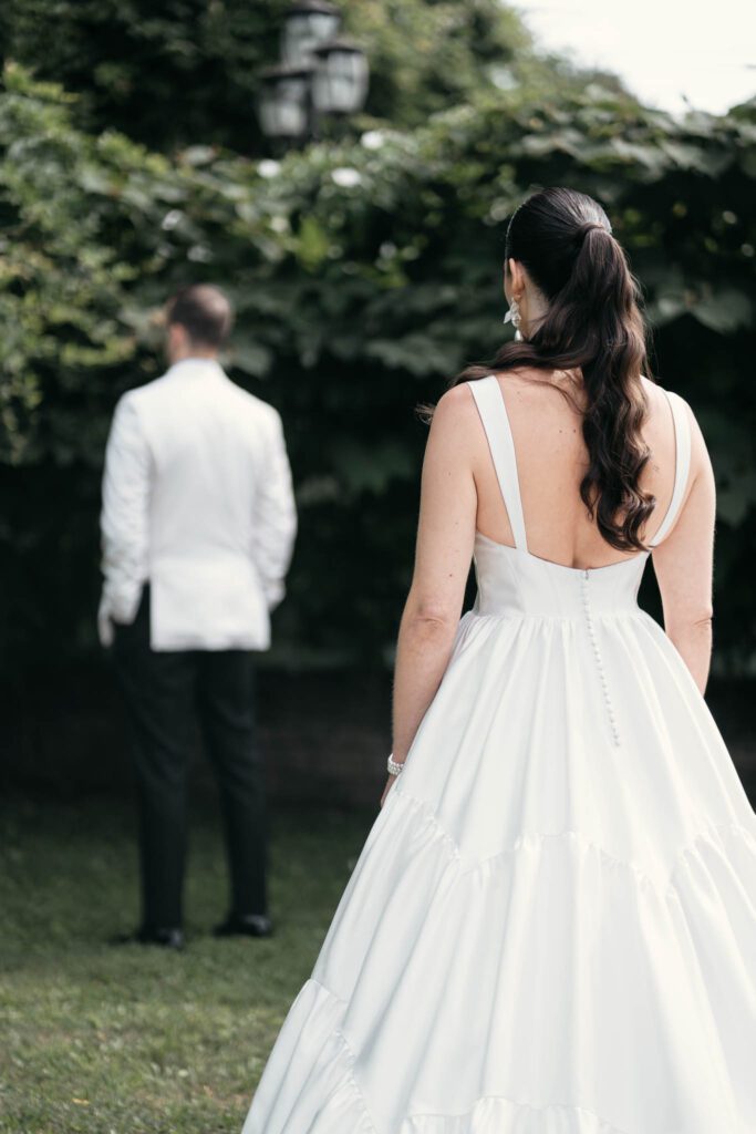 bride walking toward groom for first look moment Long Island wedding photography
