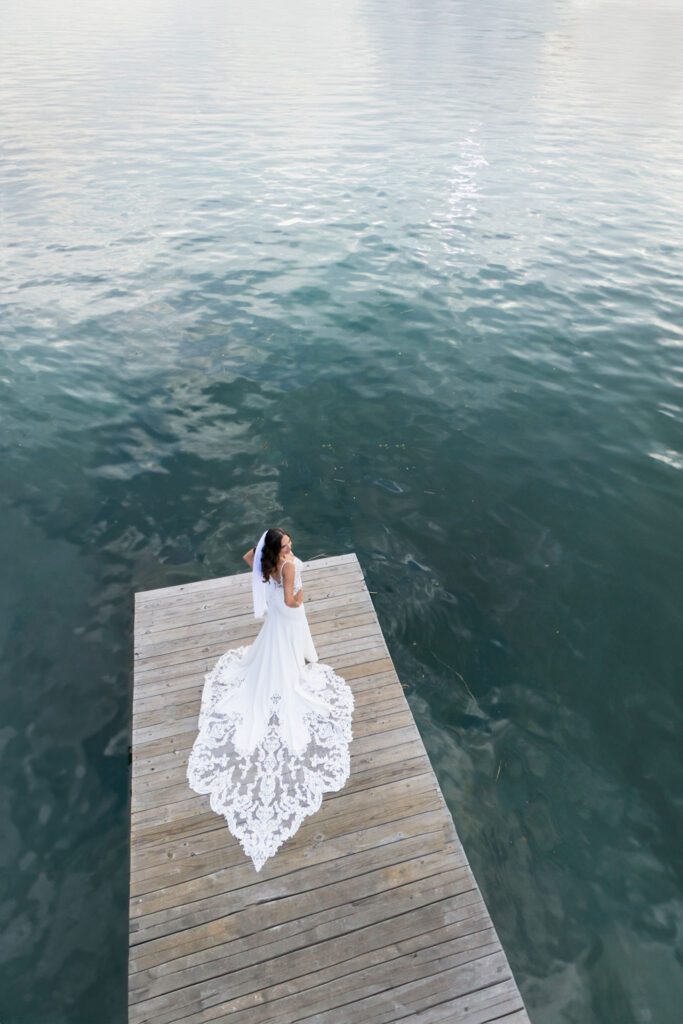 drone photo of bride at Huntington Harbor across from wedding studio in long island