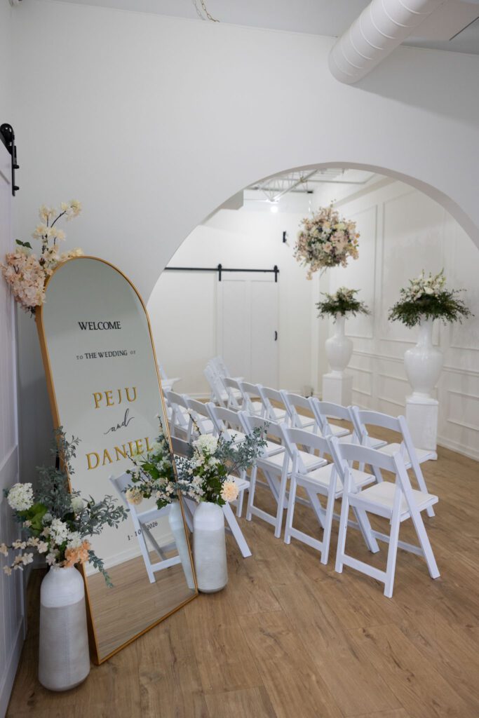 intimate wedding ceremony setup with chairs and welcome sign in Long Island photo studio venue