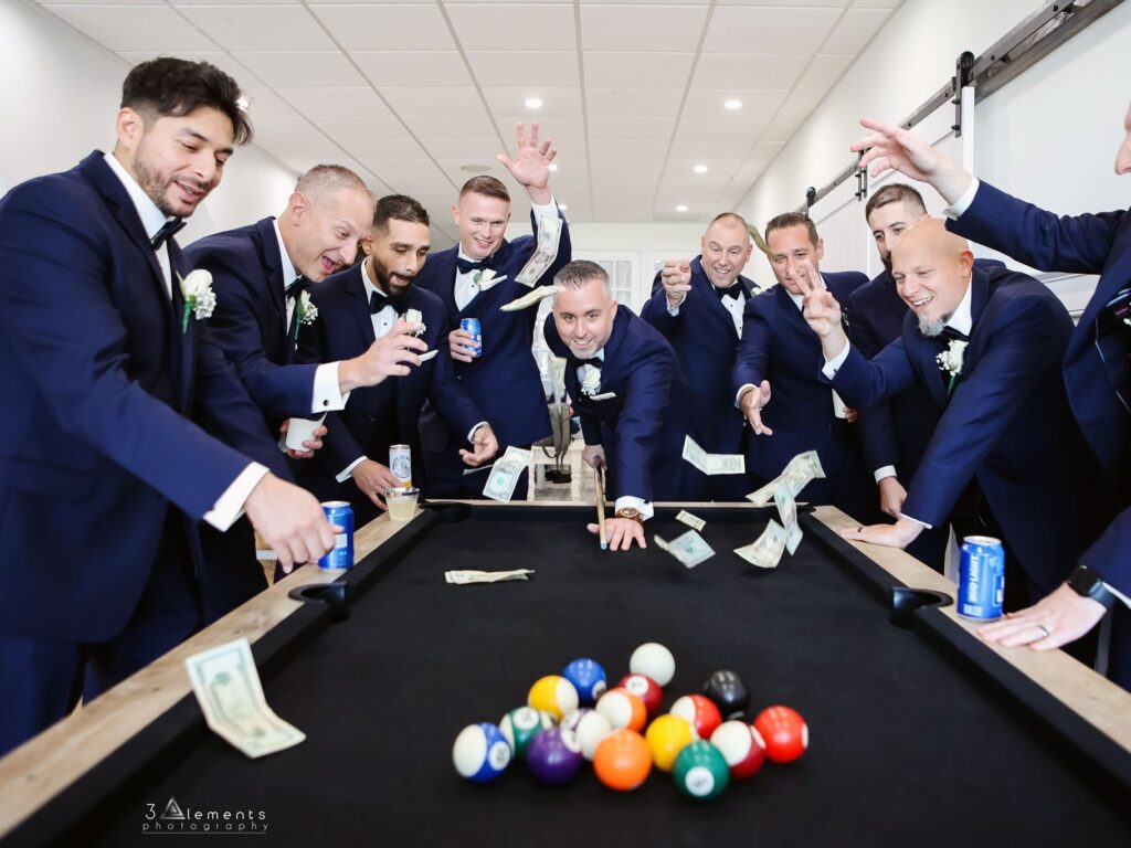 groomsmen playing pool before wedding Long Island studio